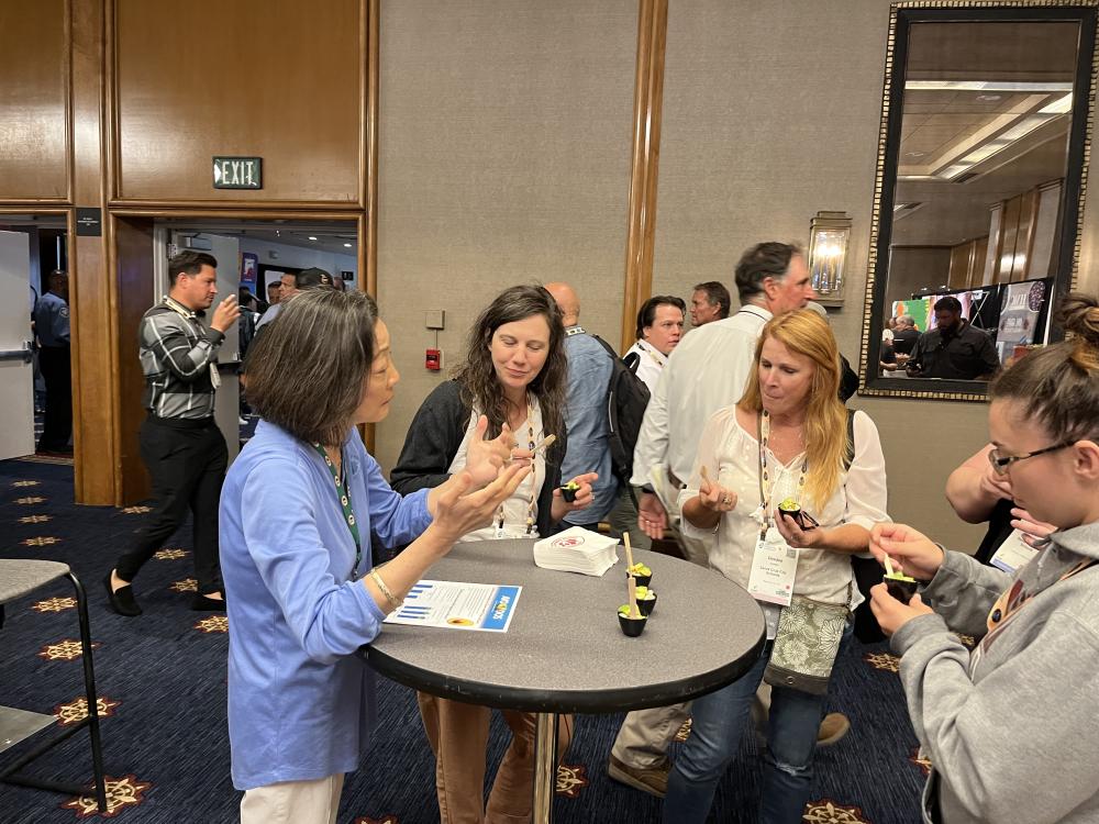 Kim Kurata discusses DOD purchases with Santa Cruz School professionals.